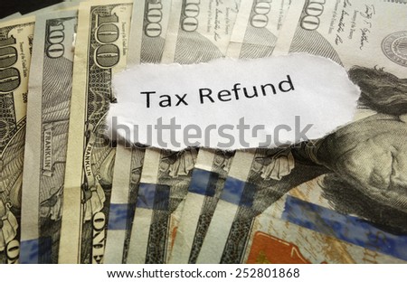 Tax Refund paper text on assorted cash