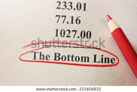 numbers and pencil with The Bottom Line circled