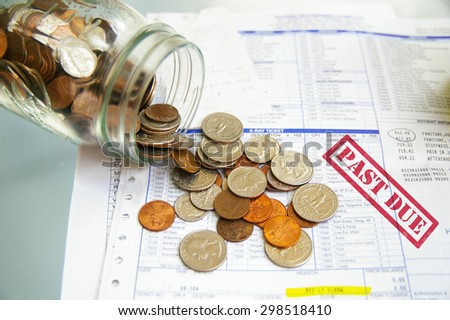coin jar with money on Past Due medical bills