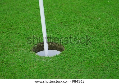 Putting green and hole