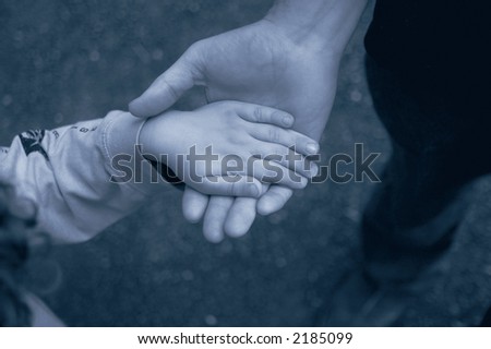 Father and son holding hands