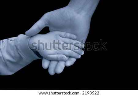 man and child holding hands - help or charity