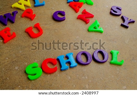 Children\'s colorful plastic letters spelling out \
