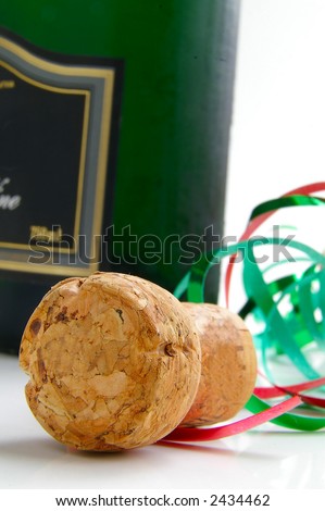 Champagne cork and colorful party ribbons