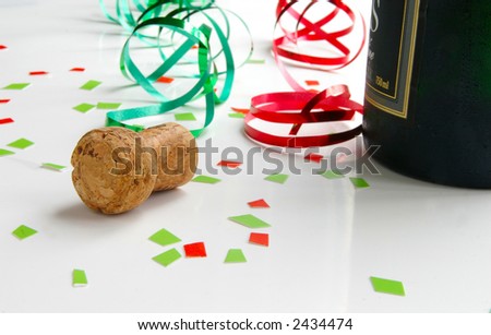 Champagne cork and colorful party ribbons