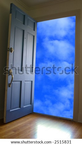 Door opening to blue sky and clouds