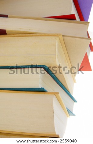 Stack of hard cover books on white background