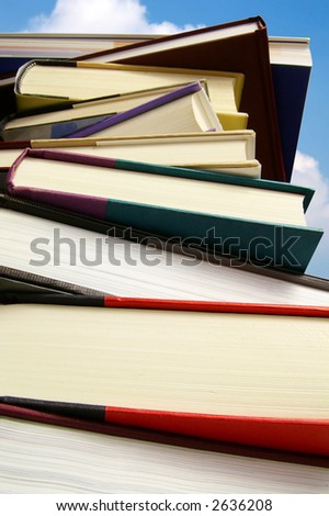 Stack of assorted hard-cover books isolated on white with clipping path