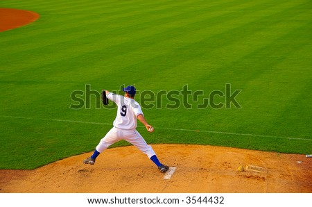 Pro baseball  pitcher throwing the ball from the mound