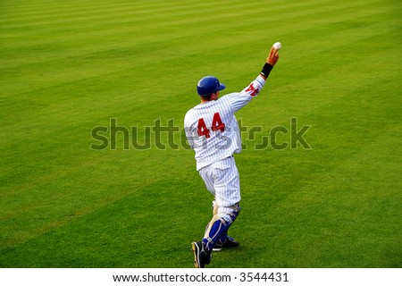 Pro baseball  player throwing the ball from the field