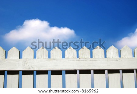 White picket fence and sky