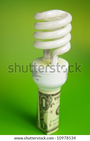 Compact fluorescent light bulb, in a dollar bill