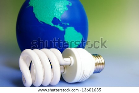 Compact fluorescent light bulb with globe background