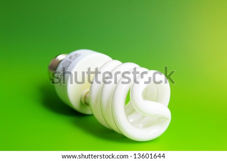 Compact fluorescent light bulb, closeup on green