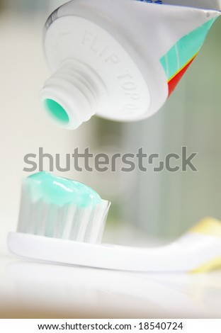 close up of tooth paste on a tooth brush