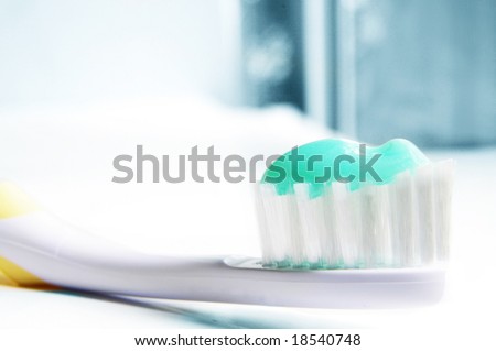 closeup of a tooth brush with tooth paste