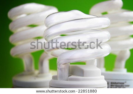 energy efficient light bulbs on green background