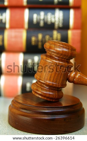 Judges gavel with a stack of law books