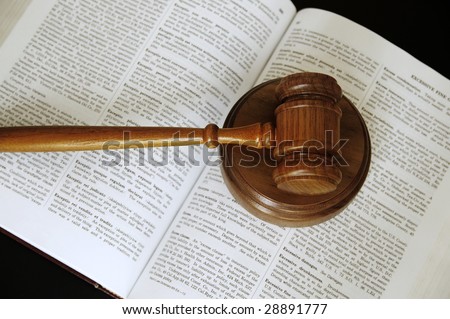 judges gavel sitting on an open law book