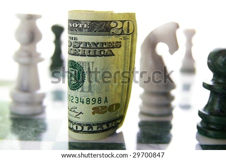 american twenty dollar bill on a chess board (financial risk or investment)