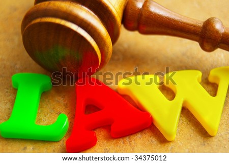 court gavel with play letters spelling \