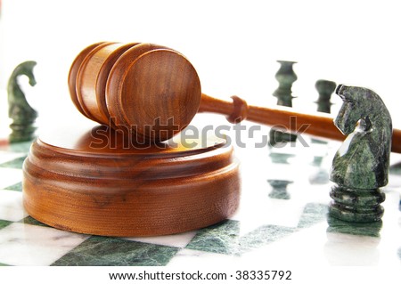 chess pieces and law gavel, over white