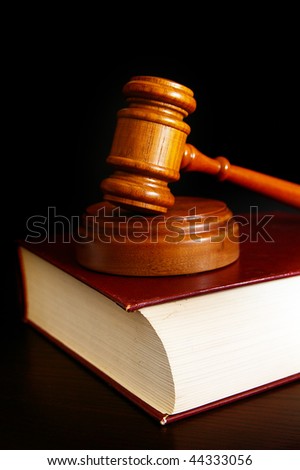 court gavel on top of  a law book