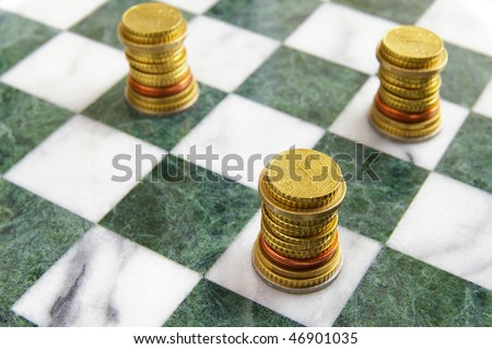Euro (EU) coins arranged on a chess board