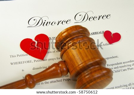 broken red hearts and legal gavel on divorce papers