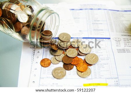 coin jar with money on medical bills
