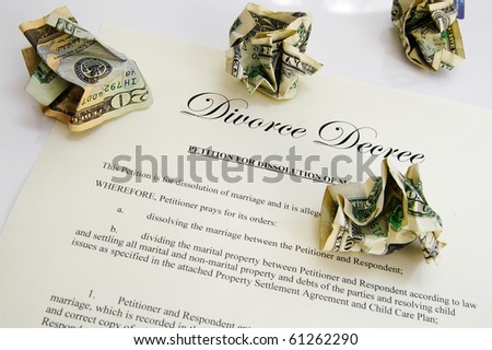 Divorce decree document and crumpled up money