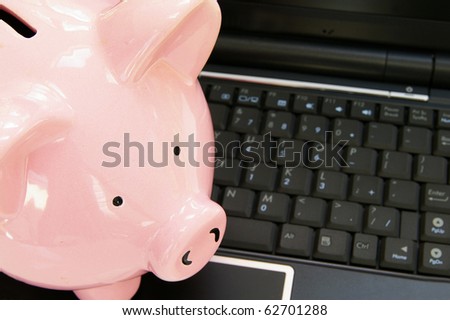 piggy bank on a computer - online banking concept