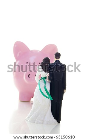 stock photo caketopper wedding couple and piggy bank money troubles 