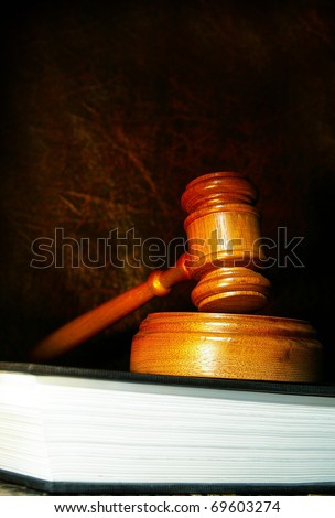 legal gavel on a law book in dramatic light