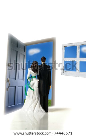 stock photo plastic caketopper wedding couple looking out a door