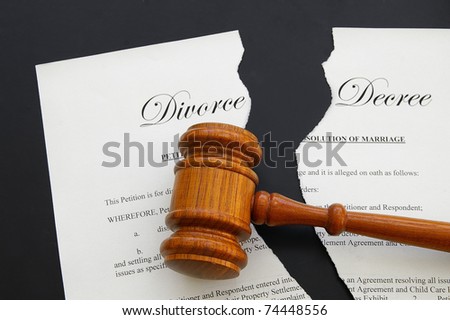 torn divorce decree and legal gavel (gavel is sharp)