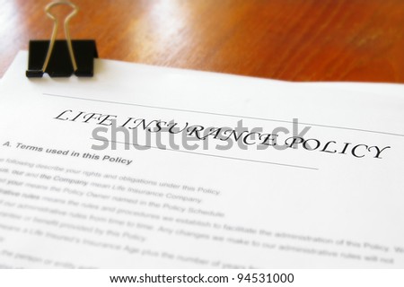 closeup of a life insurance policy on a desk