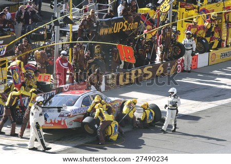 BRISTOL , TN – MARCH 22 : Kyle Busch makes a pit stop during Food City 500 at Bristol Motor Speedway on March 22, 2009 in Bristol, TN. Busch finished first after started at 19th position.