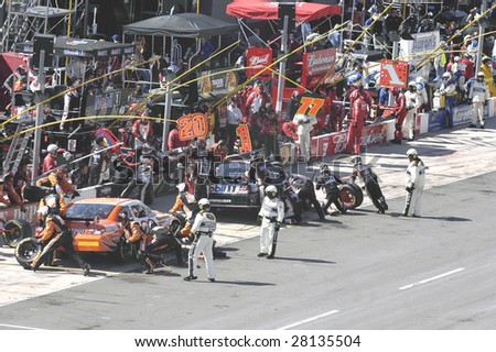 BRISTOL, TN - MARCH 22: Joey Logono makes a pit stop with the Home Depot Toyota during the Food City 500 Nascar race at the Bristol Motor Speedway March 22, 2009 in Bristol TN.