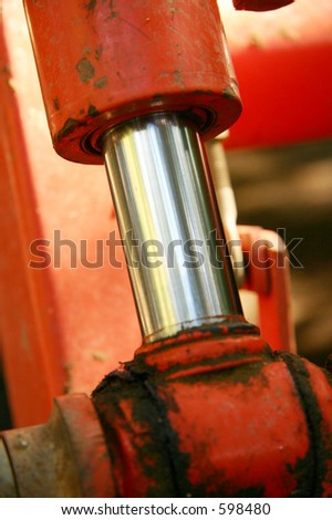 Close up shot of a hydrolic piston in a small earth mover