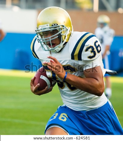 UCLA Bruins Football team practicing.  Linebacker with ball - Mark Cordell