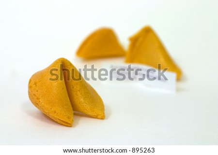 A pair of Fortune Cookies, one opened with fortune