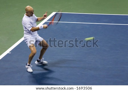 7-27-06 Los Angeles Countrywide Classic Tennis Tournament.  Andre Agassi returning at George Bastl in the second round
