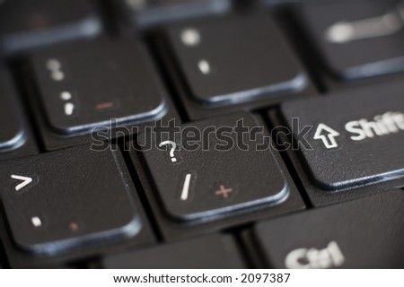 Close up of a Laptop keyboard focus on the Question Mark key