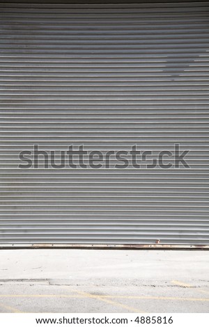 Steel rolling type garage door in an urban / industrial setting