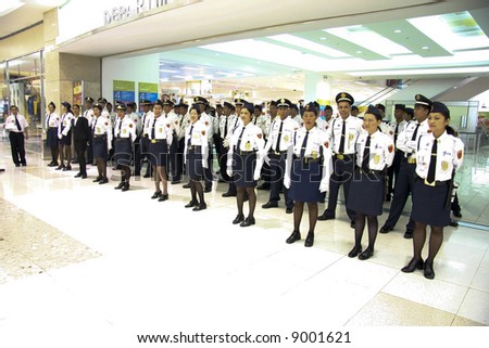 Security guards of a Makati shopping mall lining up.  Makati is a city in the Metro-Manila area in the Philippine Islands.