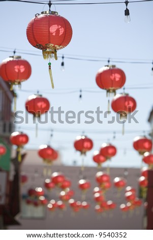 Paper lanterns hanging between buildings in the Los Angeles Chinatown