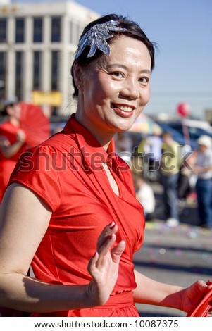 Los Angeles Chinatown, Feb 9th, 2008: Parade participant, fan dancer, in the Chinese New Year parade, celebrating Year of the Rat.