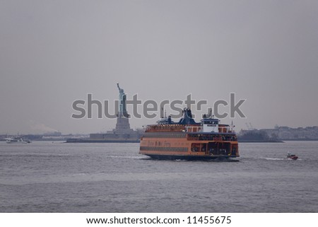 Image of the Statue of Liberty and the Staten Island Ferry (public transportation) leaving from Battery Park in New York