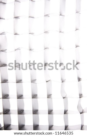 Close up of a strobe grid during a flash, creating an abstract grid pattern.